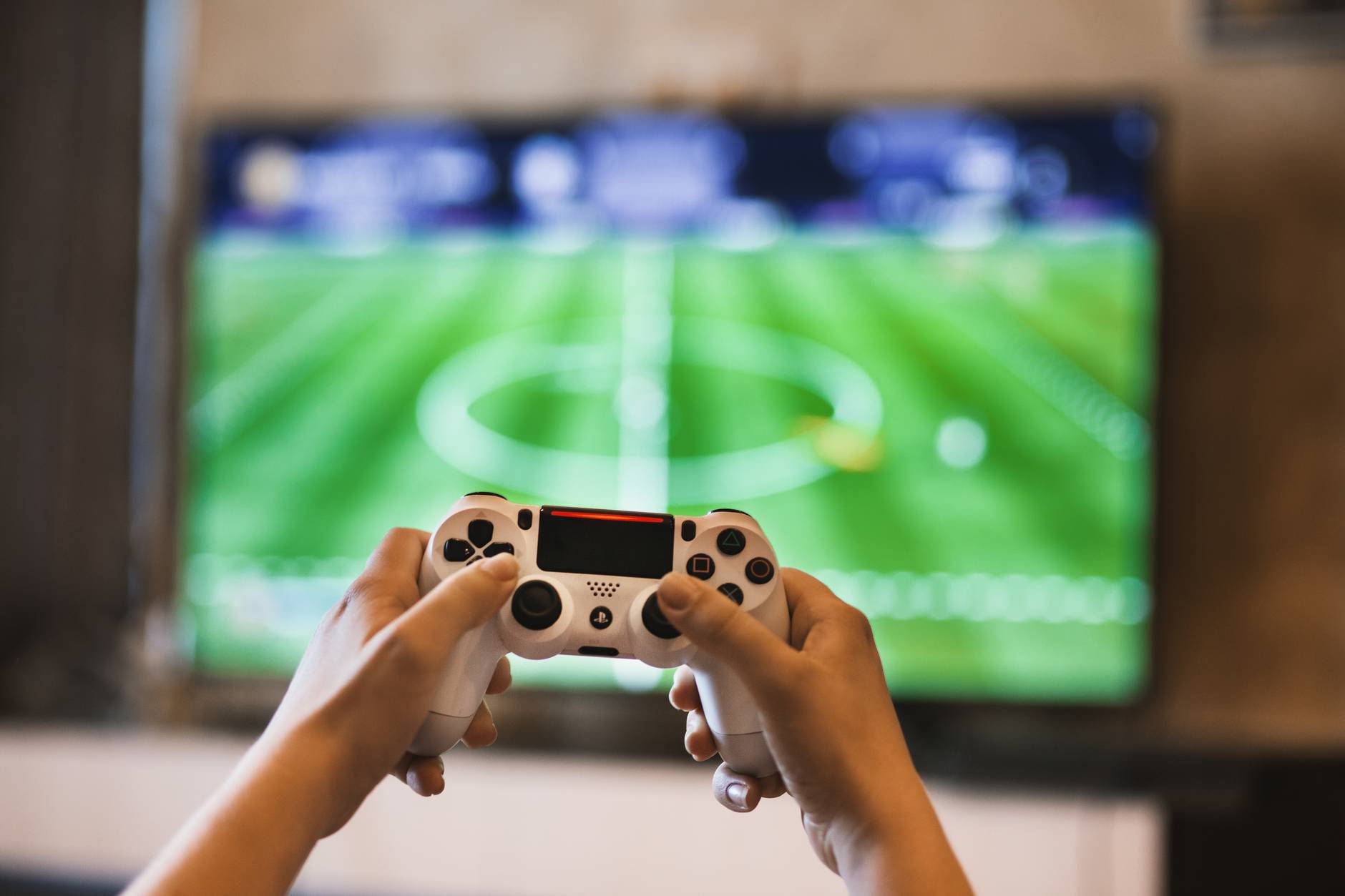 person holding game pads Benefits of limiting screen time