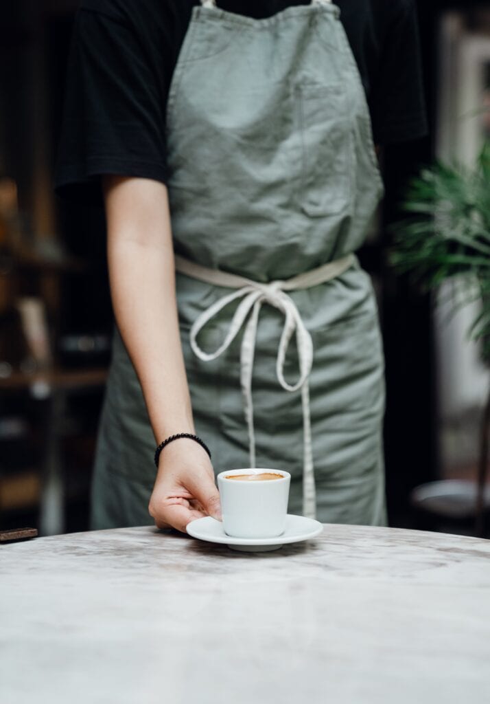 jobs for students include waitressing, photo of a waitress with a coffee