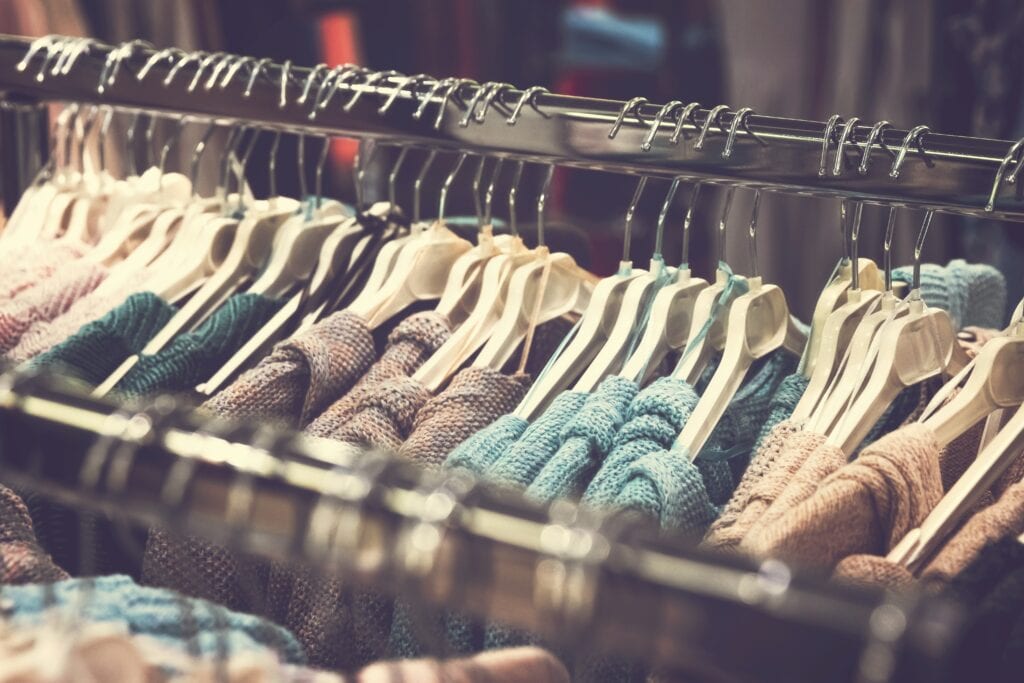 row of jumpers on hangers as retail is a common jobs for students after exams