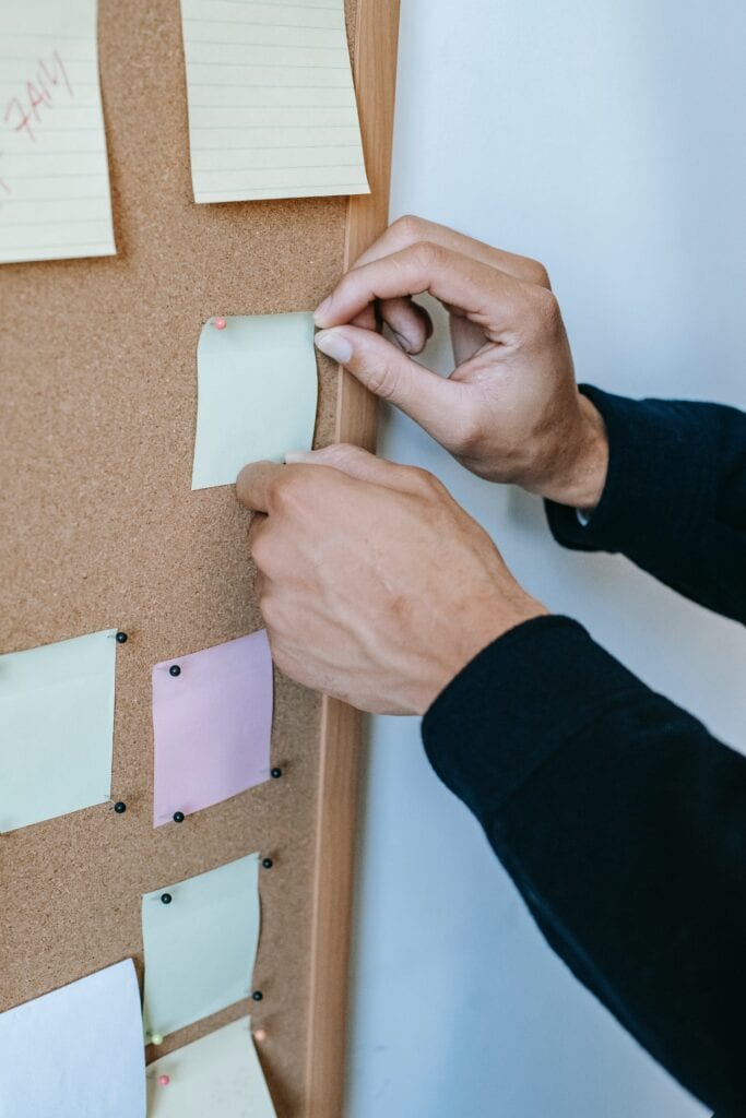 noticeboard with post it notes showing jobs for students